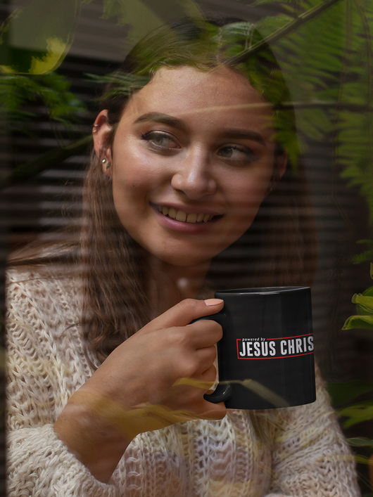 Powered by Jesus Christ - Black mug 11oz